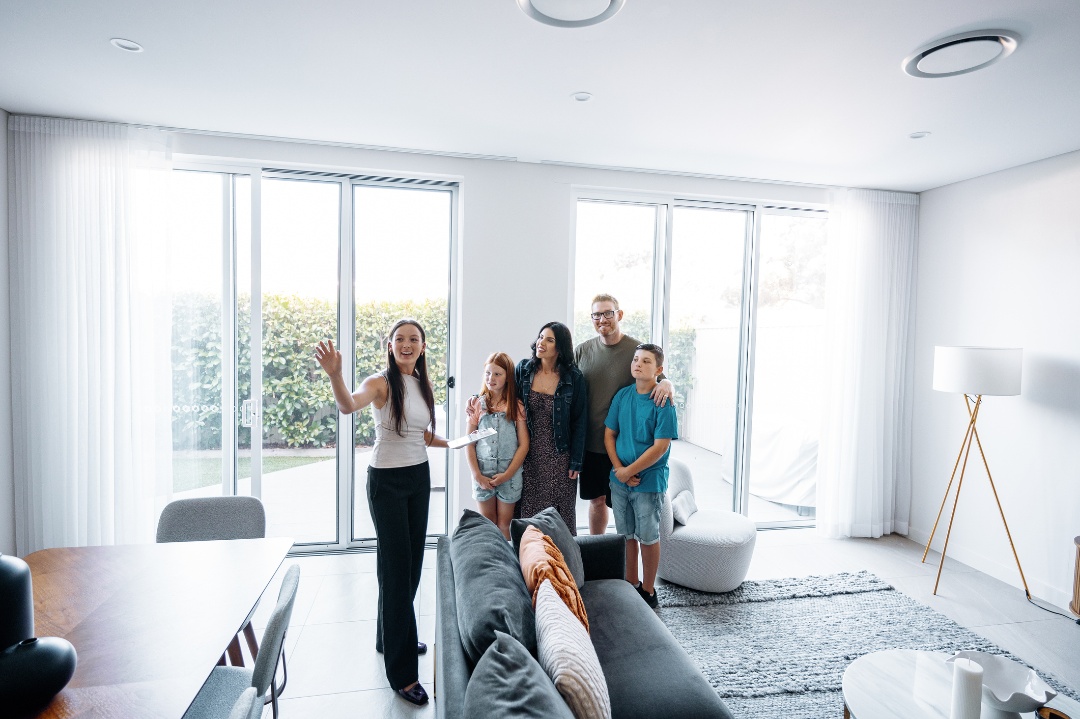 agent showing house to a family