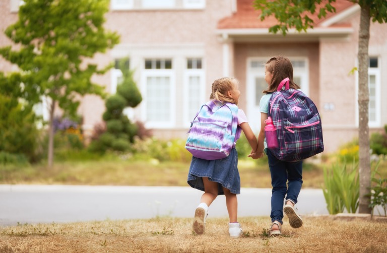 Children with bags walking